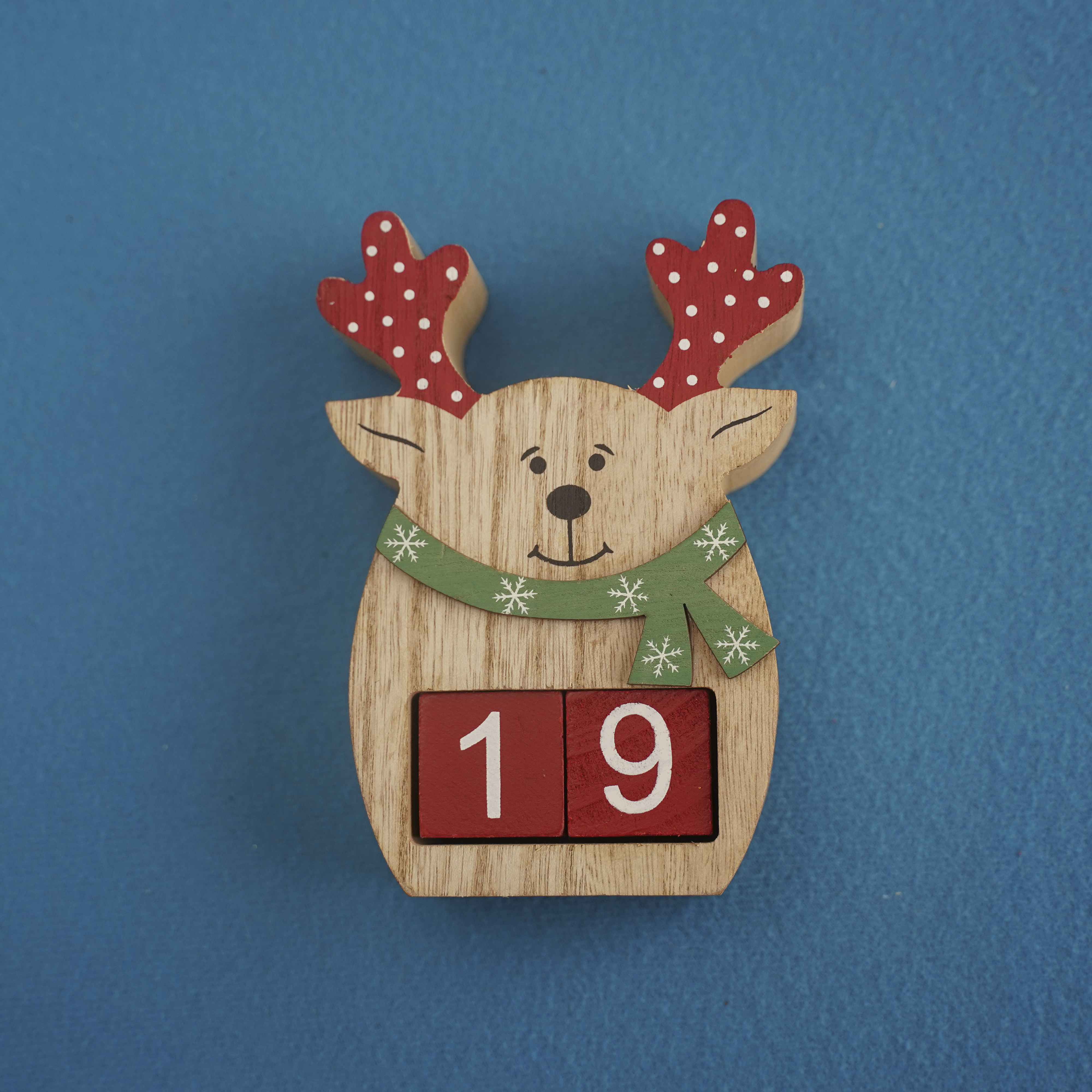 festive-wooden-deer-with-viva-magenta-cubes-19-blue-background-closeup-top-view-christmas-concept-date-time-funny-numbers-19-red-cubes-copy-space-text-event-educational-cubes-4000x4000.jpg