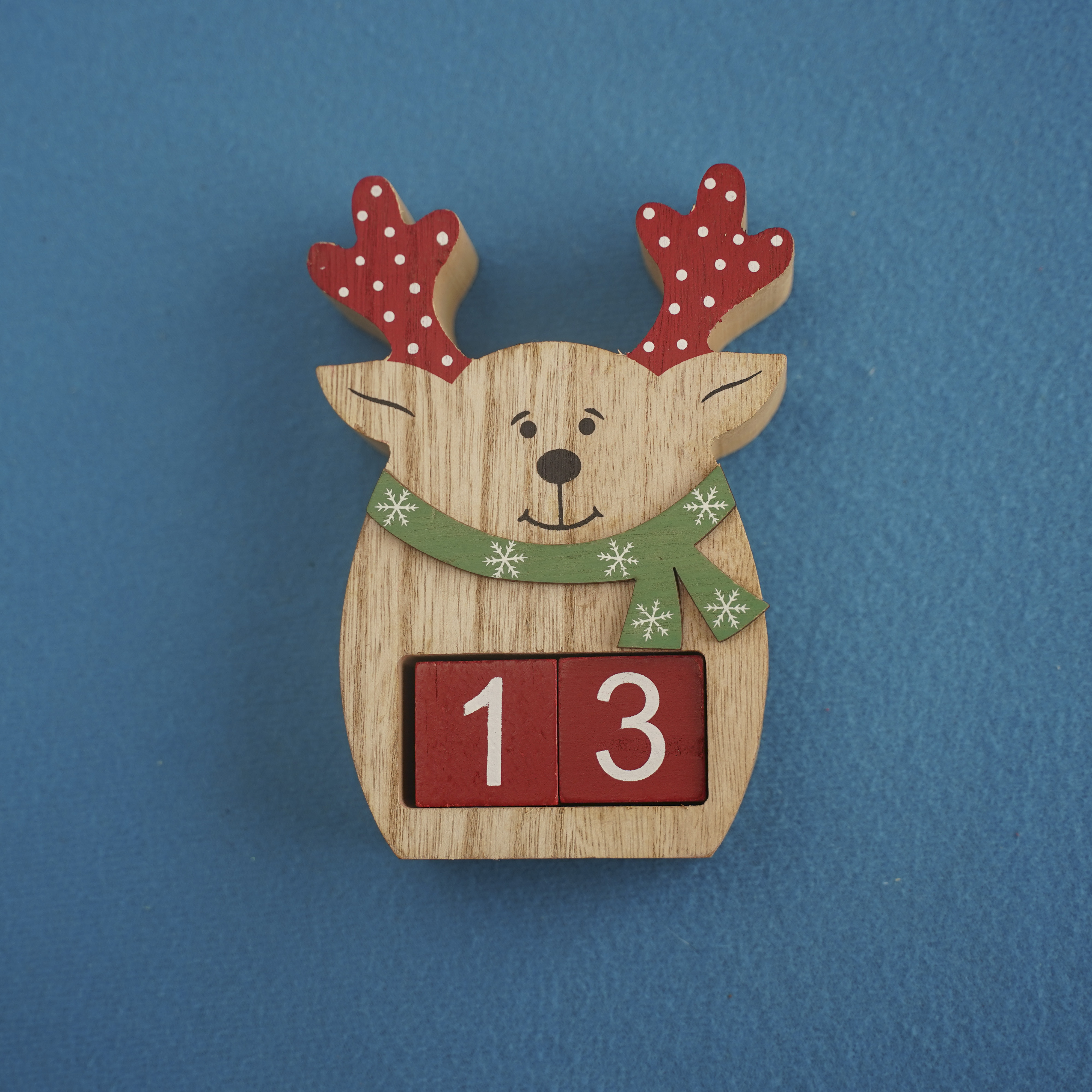festive-wooden-deer-with-viva-magenta-cubes-13-blue-background-closeup-top-view-christmas-concept-date-time-funny-numbers-13-red-cubes-copy-space-text-event-educational-cubes-4000x4000.jpg