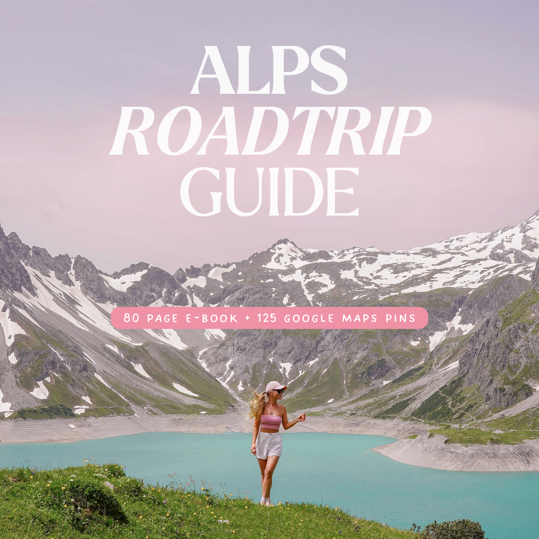 Cover of the Alps Roadtrip Guide – 80-page e-book with 125 Google Maps pins, showing a woman standing by a turquoise alpine l